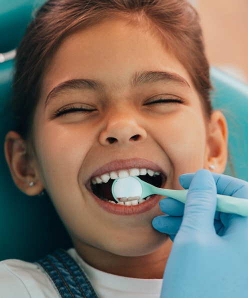 Child receiving comprehensive pediatric dentistry exam