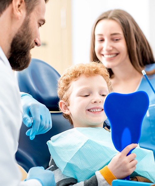 Child receiving protective dental sealants