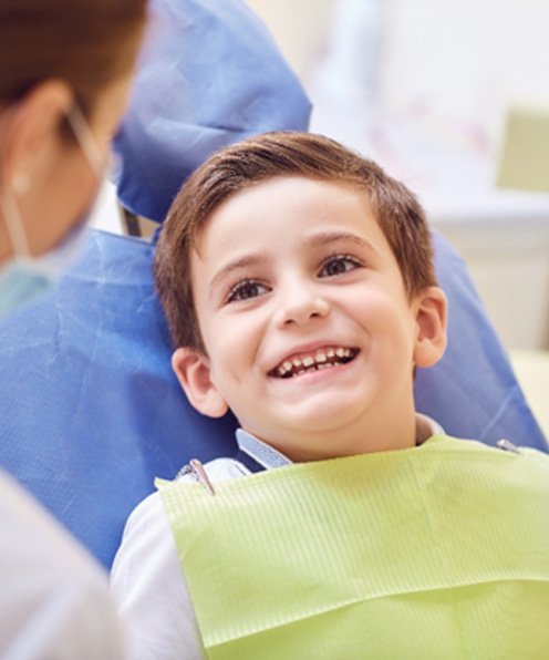 oy smiling after getting a children’s dental crown in Buffalo Grove