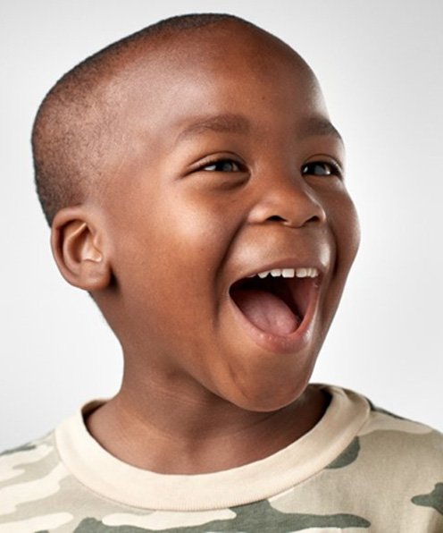 Happy little boy with a children’s dental crown in Buffalo Grove