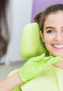 teenager smiling at dentist near Wheeling