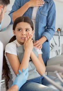 young girl with tooth pain near Wheeling