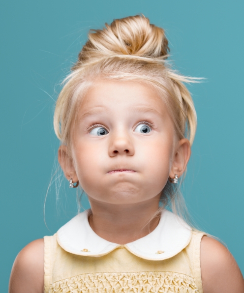 Young girl surprised before tooth extractions