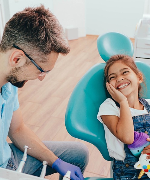 Young girl smiling at Buffalo Grove dentist during appointment