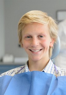 teenage patient smiling in dental chair