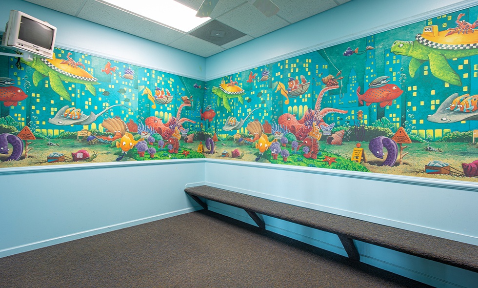 Under the ocean mural on pediatric dental office walls