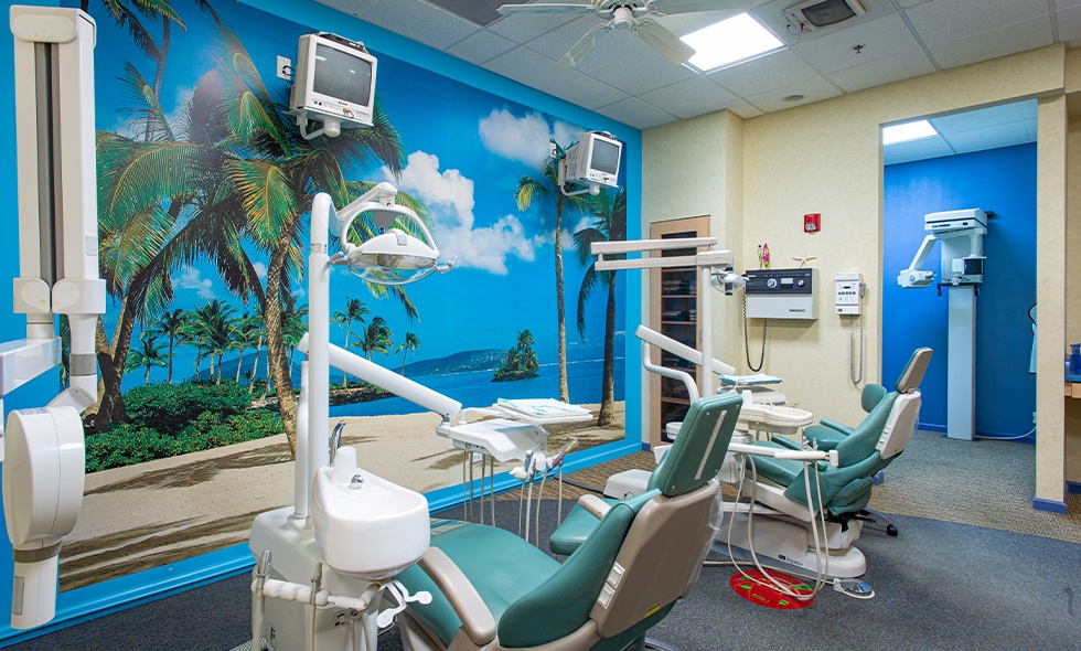 Two pediatric dentistry treatment chairs in a row