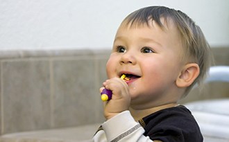 Toddler brushing teeth in Buffalo Grove