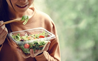 Teen eating salad in Buffalo Grove