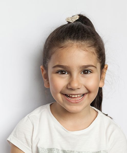 a closeup of a child smiling