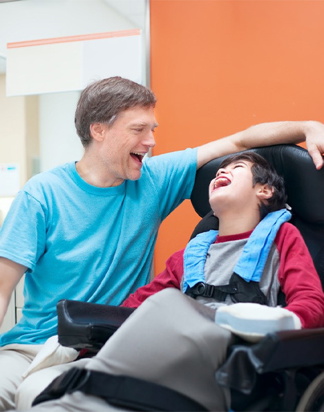 disabled children’s dentist in Buffalo Grove laughing with patient 