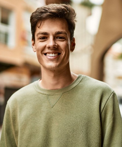 teenager smiling while outside