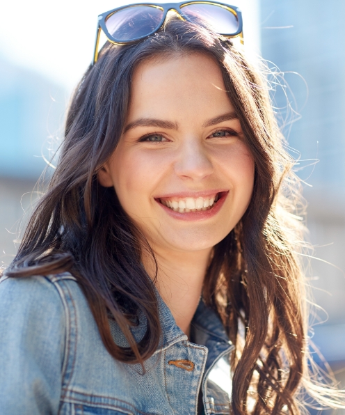 Teen woman smiling after dentistry for teens