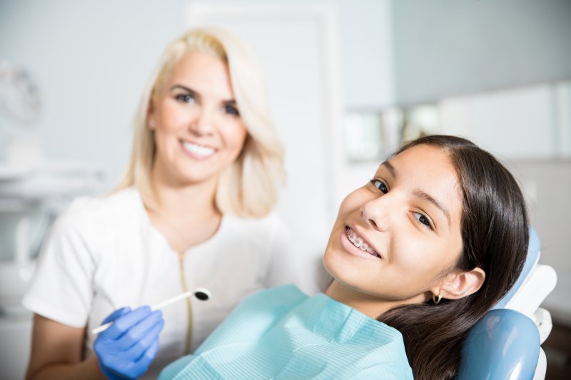 teen talking to their dentist